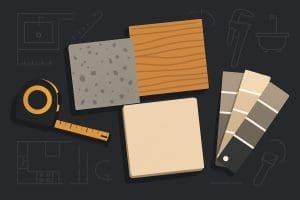 Countertop material samples arranged with a measuring tape for a kitchen countertop materials comparison